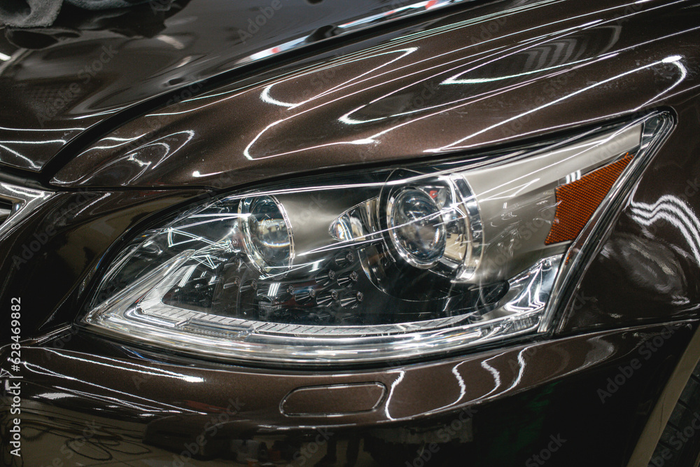 Modern Car exterior details.Headlight of a modern sport car close-up. 