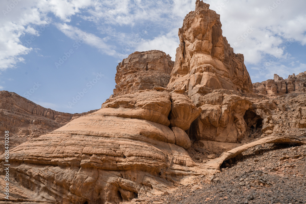 iew in the Sahara desert of Tadrart rouge tassili najer in Djanet City  ,Algeria.colorful orange sand, rocky mountains
