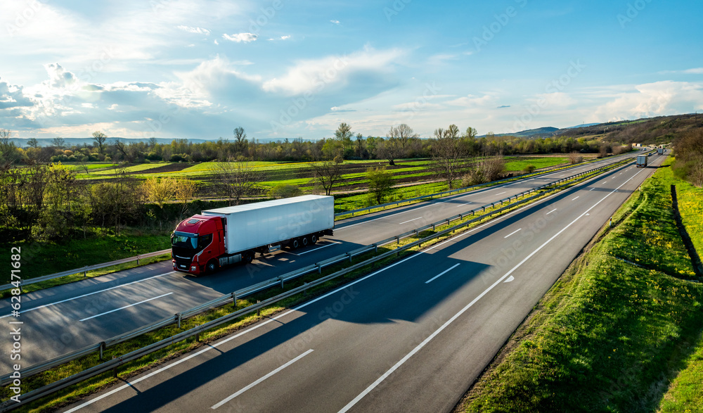 Large Transportation Truck on a highway road through the countryside