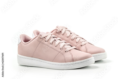 Pink tennis shoes isolated on white background