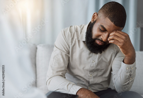Sad black man, therapist and counselling for psychology, mental health crisis and therapy for stress. Confused patient consulting psychologist for frustrated problem, anxiety and crying in depression photo