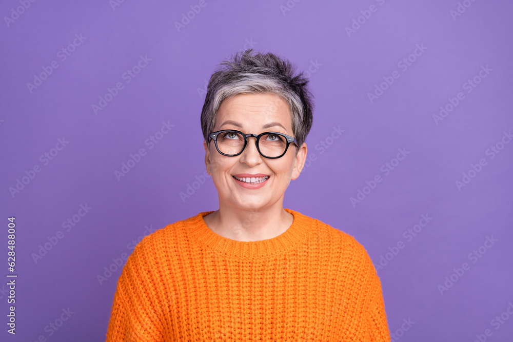 Photo of thoughtful pretty lady wear knitted pullover spectacles looking up empty space isolated purple color background