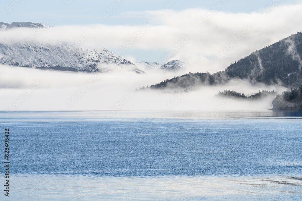 Fog on the mountains and sea in Passage Canal, Whittier, Alaska USA Fog on the mountains and sea in Passage Canal, Whittier, Alaska USA