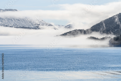 Fototapeta Naklejka Na Ścianę i Meble -  Fog on the mountains and sea in Passage Canal, Whittier, Alaska USA
