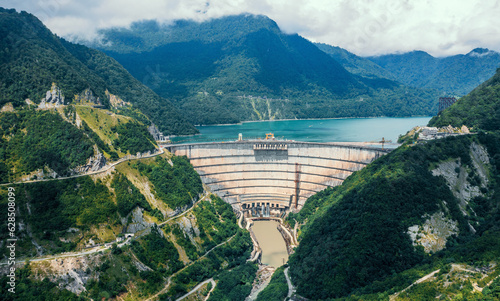 Inguri hydroelectric power plant in Georgia. Aerial view from drone of huge water dam. Hydropower energy station on Inguri River. photo