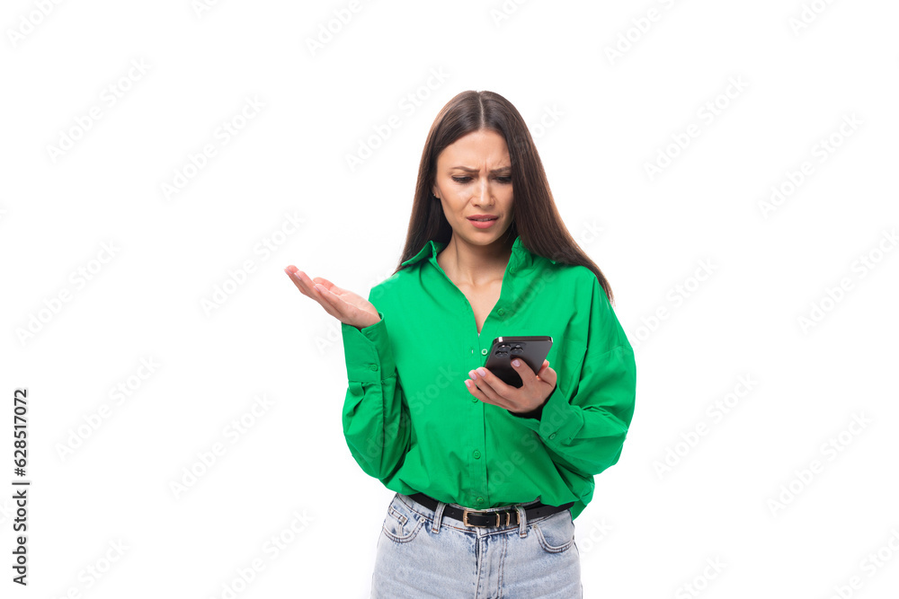 well-groomed bright young brown-haired female model with brown eyes in a green shirt posing on a white background with copy space well-groomed bright young brown-haired female model with brown eyes in a green shirt posing on a white background with copy space