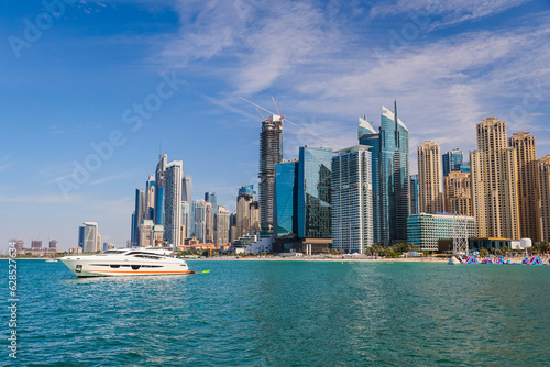 Skyscrapers of the district Dubai Marina, Yacht, luxury background.