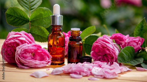 Fototapeta Naklejka Na Ścianę i Meble -  rose flower and essential oil. Spa and aromatherapy.