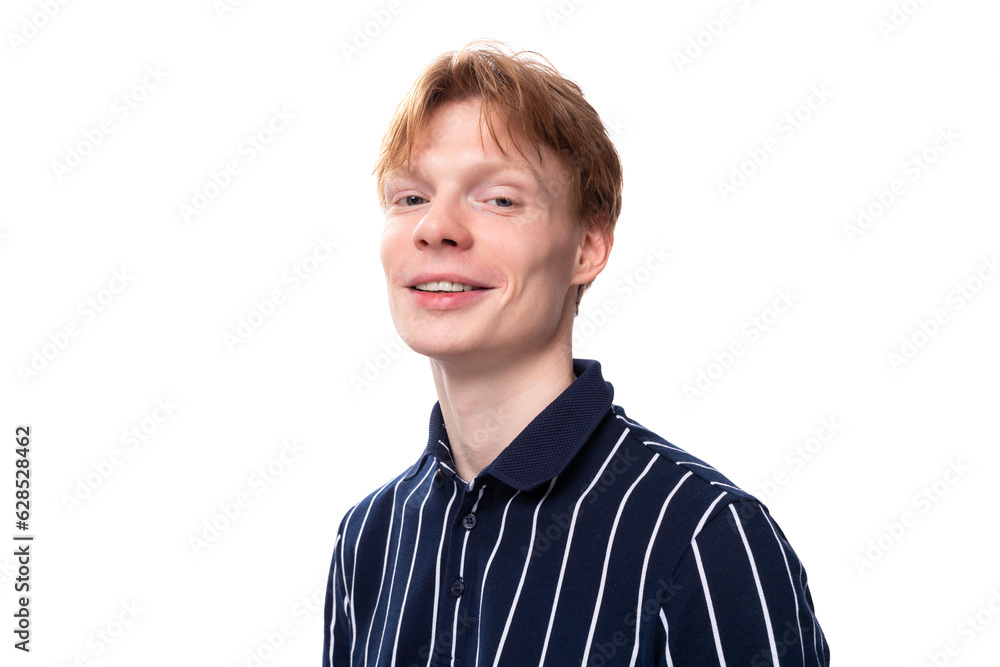 portrait of a smiling handsome european 25s blond man in a blue polo portrait of a smiling handsome european 25s blond man in a blue polo