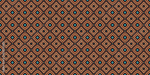 Ikat geometric folklore ornament with diamonds,  Seamless striped pattern in Aztec style photo