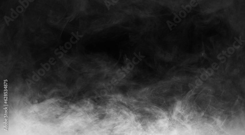 Abstract smoke texture over black. Fog in the darkness.