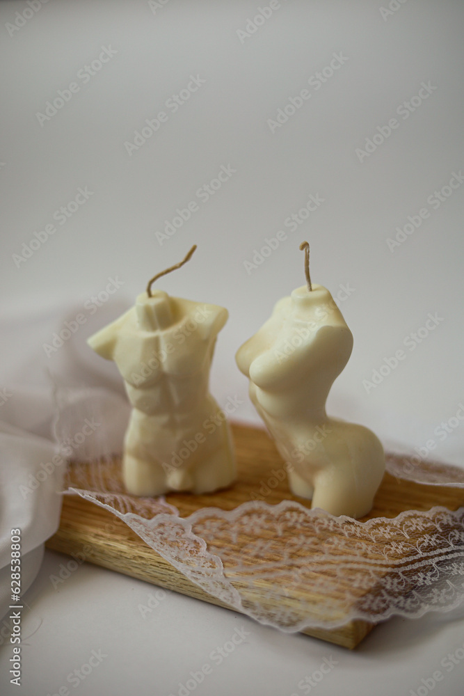 men and woman shape wax candle on wood stand men and woman shape wax candle on wood stand