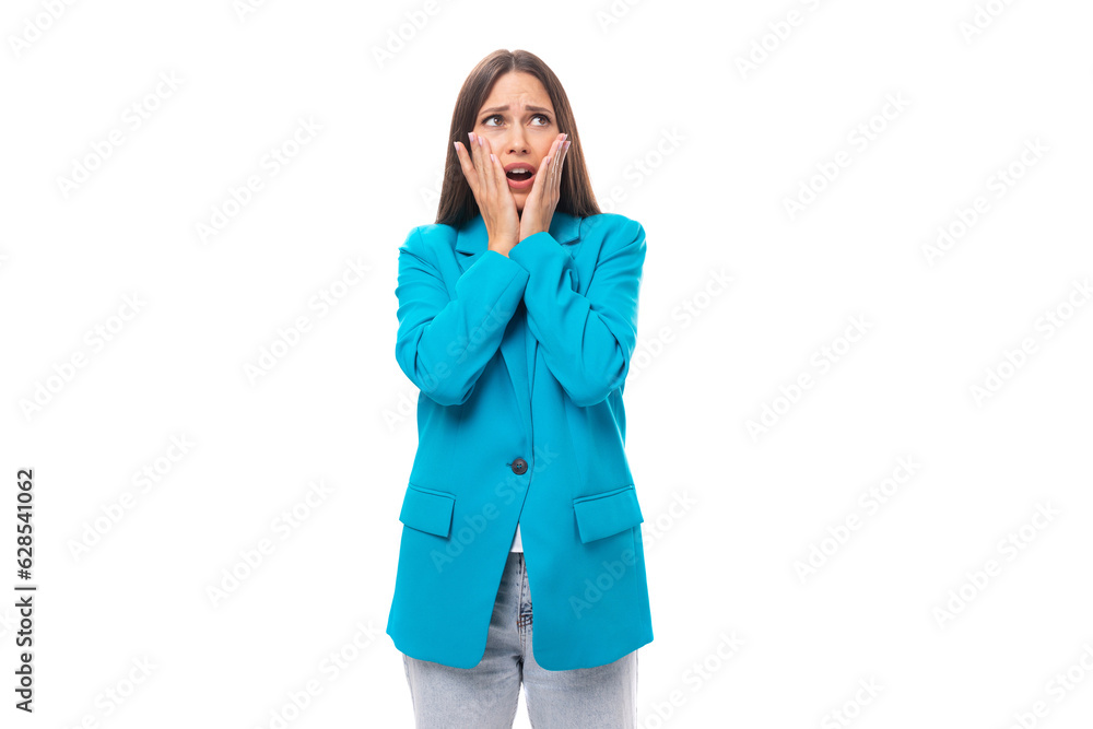 young surprised well-groomed office worker woman with black straight hair in a blue business jacket on a white background with copy space young surprised well-groomed office worker woman with black straight hair in a blue business jacket on a white background with copy space