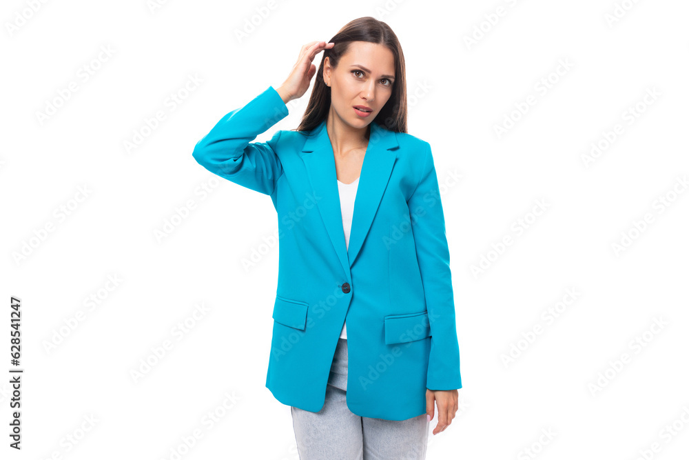 confident stylish young brunette businesswoman in a blue jacket in an image for a meeting on a white background with copy space confident stylish young brunette businesswoman in a blue jacket in an image for a meeting on a white background with copy space