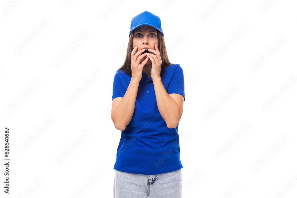 surprised pretty young caucasian brunette advertiser woman in blank blue t-shirt and cap for print illustration surprised pretty young caucasian brunette advertiser woman in blank blue t-shirt and cap for print illustration