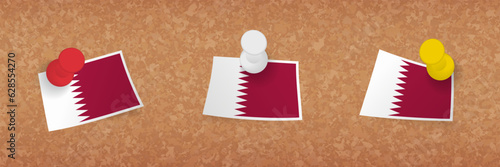 Qatar flag pinned in cork board, three versions of Qatar flag.