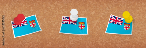 Fiji flag pinned in cork board, three versions of Fiji flag.