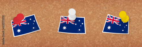 Australia flag pinned in cork board, three versions of Australia flag.