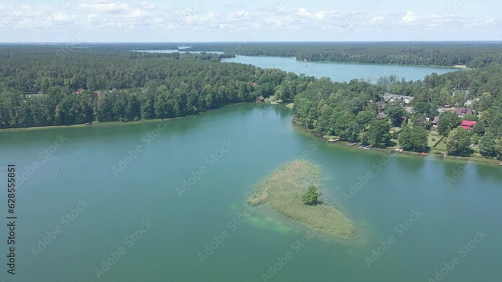 Aerial view of the islands on the lakes near Augustow on a summer,sunny day. Aerial view of the islands on the lakes near Augustow on a summer,sunny day.