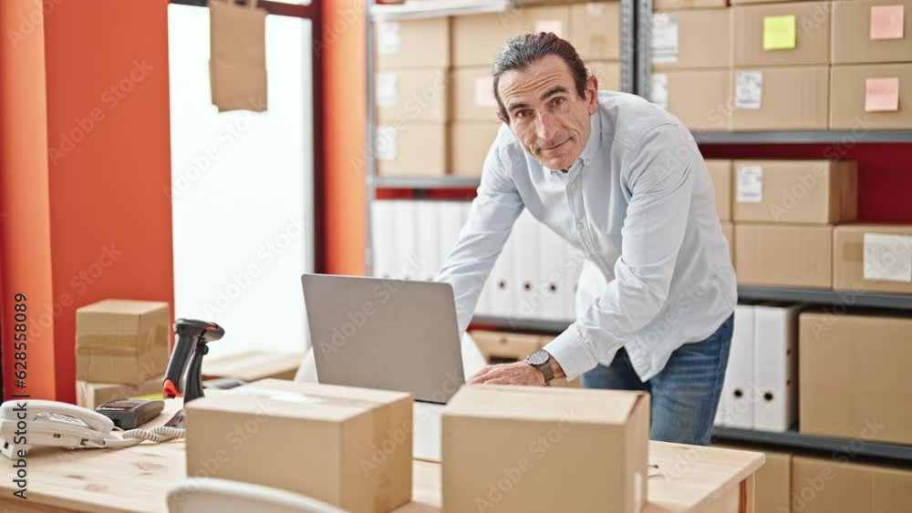 Middle age man ecommerce business worker using laptop working at office Middle age man ecommerce business worker using laptop working at office