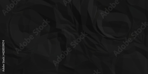 Dark crumple black paper wrinkled poster template ,blank glued creased paper texture background. black paper crumled backdrop background. used for cardboard and clarkboard.