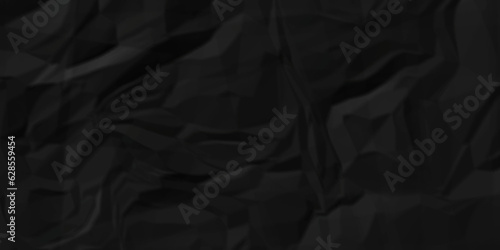 Dark crumple black paper wrinkled poster template ,blank glued creased paper texture background. black paper crumled backdrop background. used for cardboard and clarkboard.