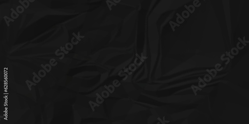 Dark crumple black paper wrinkled poster template ,blank glued creased paper texture background. black paper crumled backdrop background. used for cardboard and clarkboard.