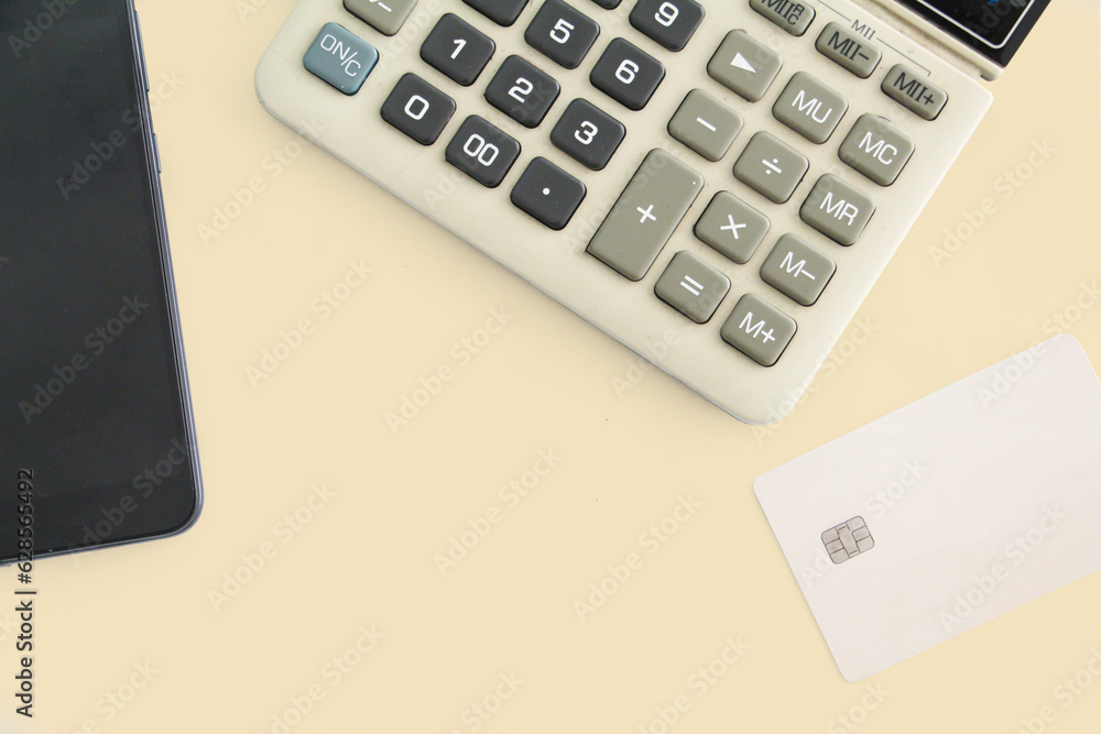 top view credit card with calculator and mobile phone or phone. working office concept. payment concept. account or financial. purchase or buyer concept. space, copy space. top view credit card with calculator and mobile phone or phone. working office concept. payment concept. account or financial. purchase or buyer concept. space, copy space.