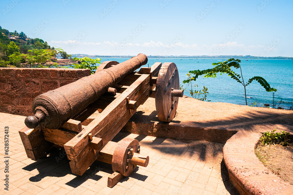 Old cannon on the candolim beach at Goa, India