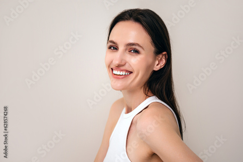 happy female with laminated eyebrows looking at camera