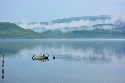 Loch Fyne, Argyll, Scotland, with small boat on a misty morning © Chris