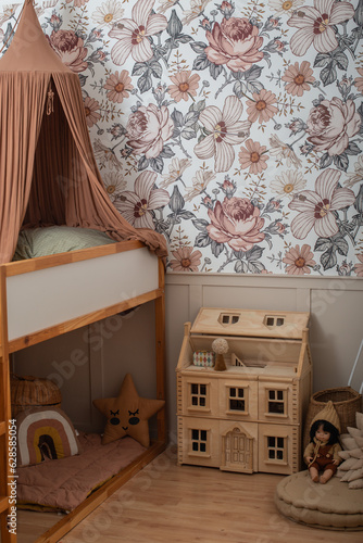 Cute child's room interior with toys and modern furniture. beautiful interior and design of a children's room for a little girl. canopy and wooden house for dolls