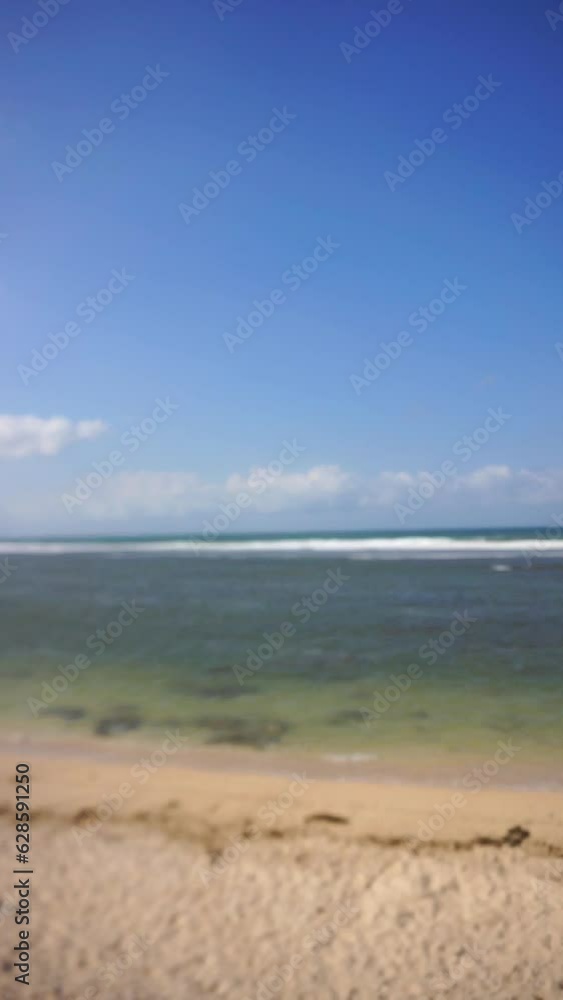 video of beautiful vertical views of the sea with small waves, beautiful natural panoramas during the day at Sayang Heulang beach, South Garut video of beautiful vertical views of the sea with small waves, beautiful natural panoramas during the day at Sayang Heulang beach, South Garut