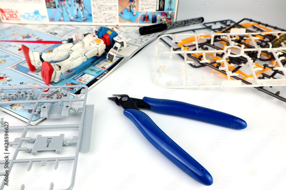 gunpla nippers , modeler nippers or pliers is put on white table for