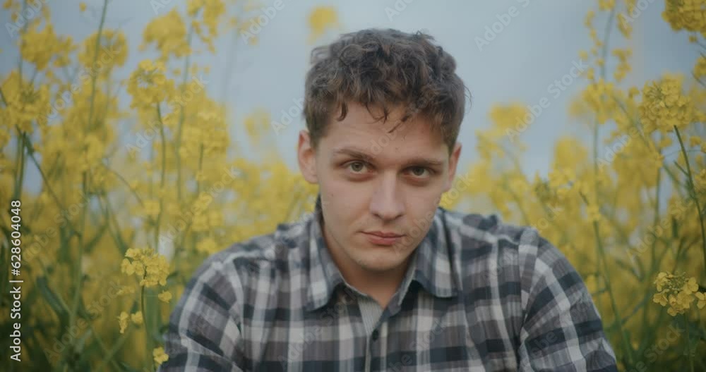 Farmer Amidst Yellow Flowers Blooming In Farm. Farmer Amidst Yellow Flowers Blooming In Farm.