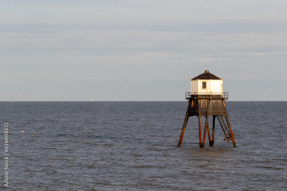 sunset over Dovercourt low lighthouse, built in 1863 and discontinued in 1917 and restored in 1980 the 8 meter lighthouse is still a iconic sight