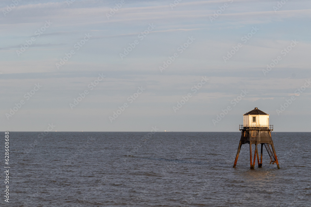 sunset over Dovercourt low lighthouse, built in 1863 and discontinued in 1917 and restored in 1980 the 8 meter lighthouse is still a iconic sight