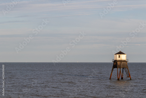 sunset over Dovercourt low lighthouse, built in 1863 and discontinued in 1917 and restored in 1980 the 8 meter lighthouse is still a iconic sight