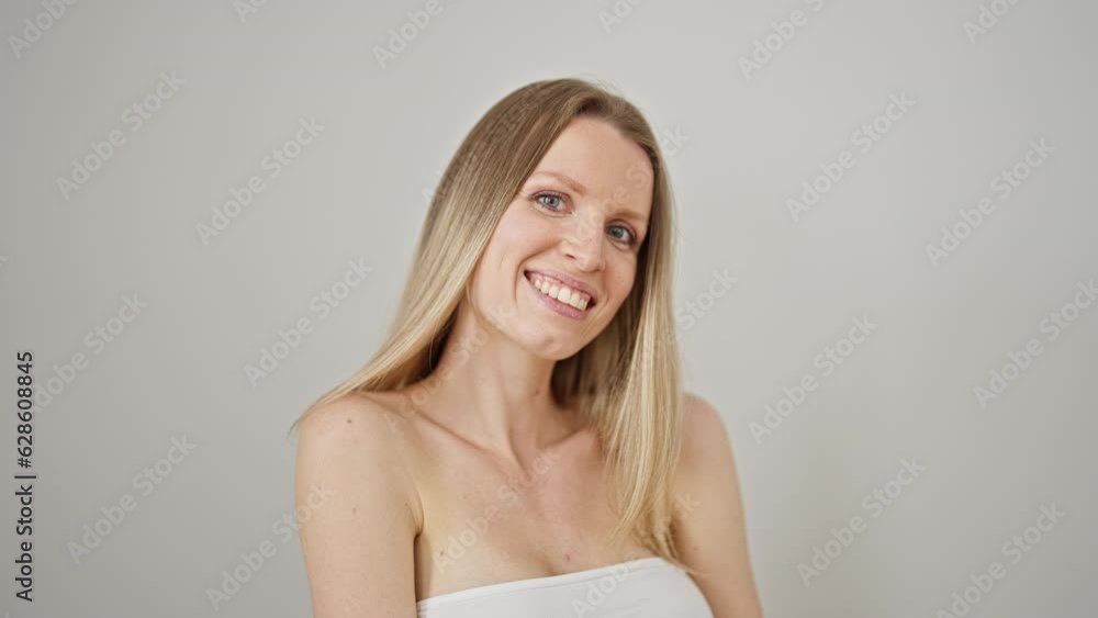 Young blonde woman smiling confident standing over isolated white background Young blonde woman smiling confident standing over isolated white background