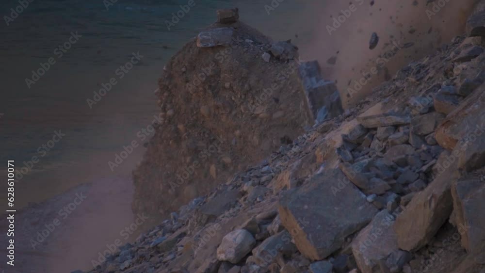 Slow motion shot of Rocks falling from mountain due to landslide in ...