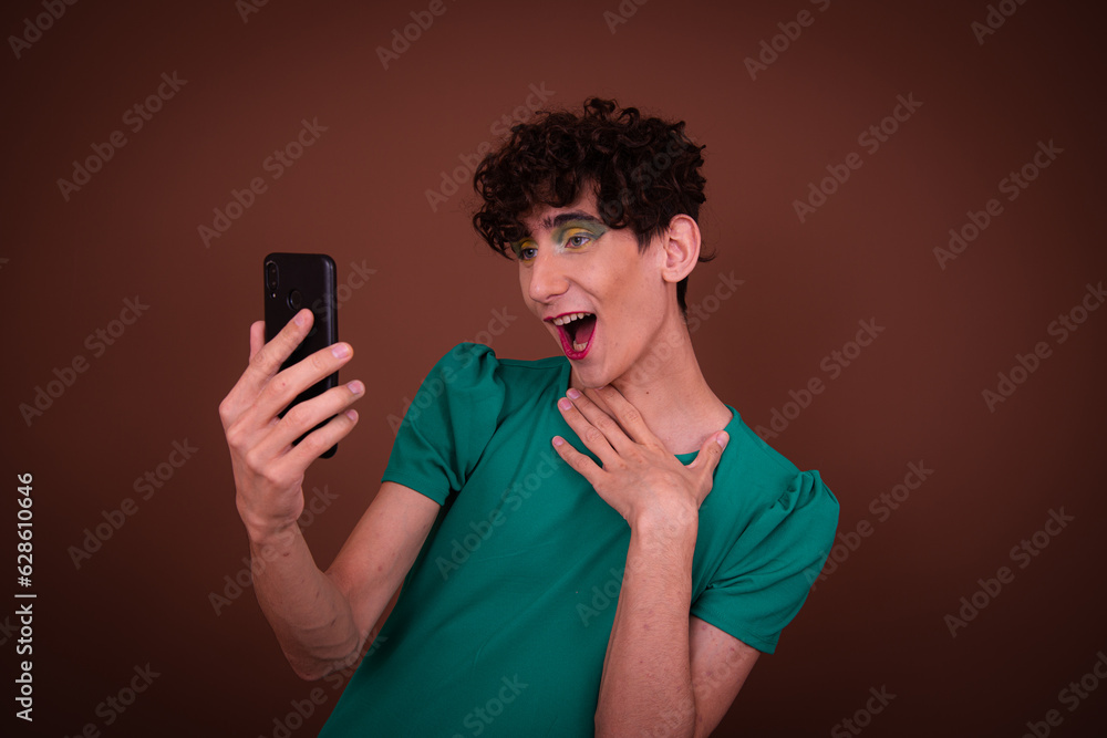Drag queen poses in the studio and takes a selfie. Drag queen poses in the studio and takes a selfie.