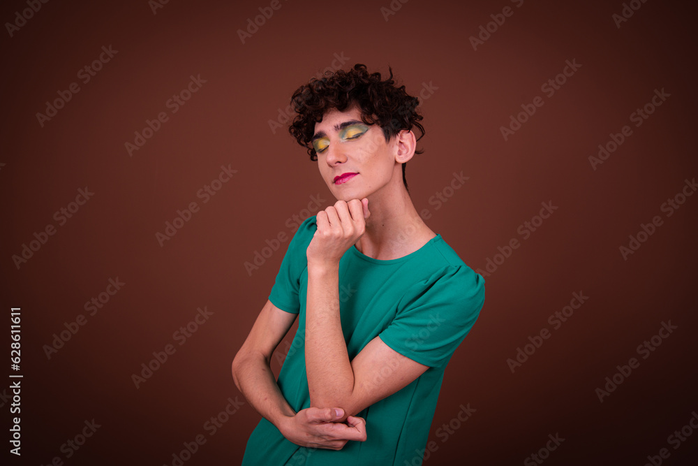 Funny drag queen posing in the studio on a brown background. Funny drag queen posing in the studio on a brown background.