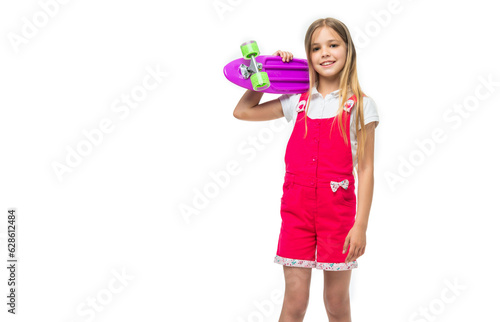 teen girl with skateboard in studio, banner. teen girl with skateboard on background.