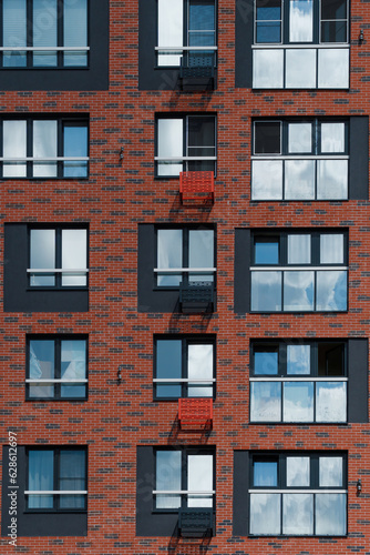 the brown facade of a new residential apartment building in Scandinavian style