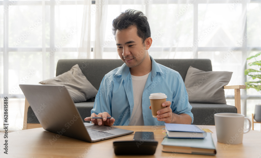 Man hands using laptop and holding credit card with social media as Online shopping concept in morning light Man hands using laptop and holding credit card with social media as Online shopping concept in morning light