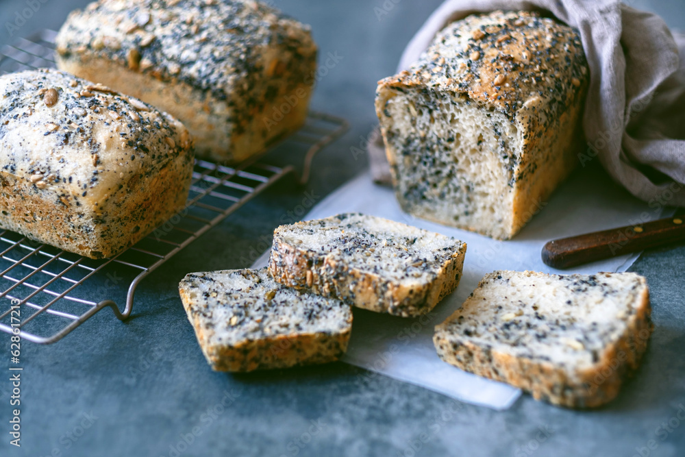 Homemade healthy freshly baked organic whole grain bread with seeds on concrete table. Vegan keto diet. top view. High quality photo