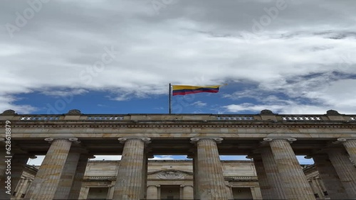 facade of the Senate of the Republic of Colombia with the flag waving in the center of Bogotá