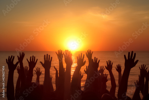 Big group of people having fun in success victory and happy pose with raised arms on mountain top against sunset lakes and mountains. Generative AI.