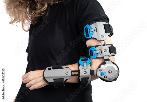 Canvas Print Woman with elbow brace or postoperative ROM brace