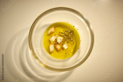 Exquisite Olive Oil Spread on a White Table